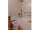 Bathroom showcasing a soaking tub, toilet with blue light, and stylish beige shower tile at 10609 N 32Nd Cir, Phoenix, AZ 85029