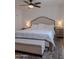 Comfortable bedroom features hardwood floors, a cozy bed, and a ceiling fan for added comfort at 10609 N 32Nd Cir, Phoenix, AZ 85029