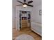 Stylishly designed Bedroom with a modern ceiling fan, closet, and white crib, complete with luxury flooring at 10609 N 32Nd Cir, Phoenix, AZ 85029