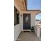 Inviting entryway with wrought iron door, white brick, and a wellcome mat at 10609 N 32Nd Cir, Phoenix, AZ 85029