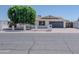 Charming single-story home featuring a white brick facade, well-manicured lawn, and an attached two-car garage at 10609 N 32Nd Cir, Phoenix, AZ 85029