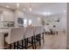 Bright open kitchen features an island with counter seating and a dining area at 10609 N 32Nd Cir, Phoenix, AZ 85029