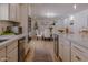 Bright open kitchen with an island and light wood floors at 10609 N 32Nd Cir, Phoenix, AZ 85029