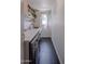 Functional laundry room features modern washer/dryer, a marble countertop, and floating shelves at 10609 N 32Nd Cir, Phoenix, AZ 85029