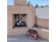 A brick fireplace sits in the backyard with a supply of firewood on hand at 10609 N 32Nd Cir, Phoenix, AZ 85029