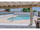 View of a private swimming pool behind the home's back patio and outdoor seating area at 10609 N 32Nd Cir, Phoenix, AZ 85029