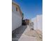 Exterior view showing a side yard with a wooden gate and cinder block fencing for privacy and security at 10609 N 32Nd Cir, Phoenix, AZ 85029