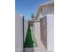 Side yard with artificial turf between fenced area with wooden gate and shed at 10609 N 32Nd Cir, Phoenix, AZ 85029