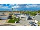 Aerial view of a home showcasing solar panels, landscaped yard, and a driveway at 11025 N 45Th Ln, Glendale, AZ 85304