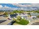 Drone shot showcases this home's solar panels, landscaped yard, and a driveway at 11025 N 45Th Ln, Glendale, AZ 85304