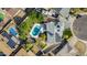 Aerial view of a home with solar panels, a pool, a backyard, and a well-maintained roof at 11025 N 45Th Ln, Glendale, AZ 85304