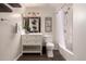 Well-appointed bathroom with stylish vanity, framed mirror, and bathtub-shower combination with decorative accents at 11025 N 45Th Ln, Glendale, AZ 85304