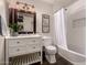 Well-appointed bathroom with stylish vanity, framed mirror, and bathtub-shower combination with decorative accents at 11025 N 45Th Ln, Glendale, AZ 85304