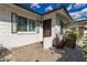 Front porch with a brick wall, an elegant door, and iron window decorations at 11025 N 45Th Ln, Glendale, AZ 85304