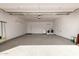 Spacious garage featuring speckled epoxy floors, laundry hookups, and ample storage space at 11025 N 45Th Ln, Glendale, AZ 85304