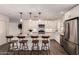 Beautiful kitchen with granite counters, stainless appliances, seating at the island, and ample cabinet storage at 11025 N 45Th Ln, Glendale, AZ 85304