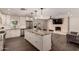 Gourmet kitchen with stainless steel appliances, granite countertops and a center island with seating for four at 11025 N 45Th Ln, Glendale, AZ 85304