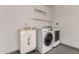 Efficient laundry room with modern washer and dryer, sink, and storage providing a functional space for laundry tasks at 11025 N 45Th Ln, Glendale, AZ 85304