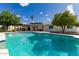 Backyard pool with a lounge area and well-maintained landscaping at 11025 N 45Th Ln, Glendale, AZ 85304