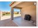 Enjoy the large, shaded back patio that overlooks the lush green lawn and charming shed, perfect for outdoor gatherings at 1144 E Elm Rd, San Tan Valley, AZ 85140