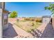 Serene backyard featuring a brick patio, storage shed, and a well-maintained lawn area, perfect for outdoor entertaining at 1144 E Elm Rd, San Tan Valley, AZ 85140
