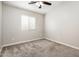 Bedroom with ceiling fan and a large window at 1144 E Elm Rd, San Tan Valley, AZ 85140