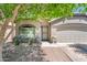 Inviting home exterior showcasing a well-kept front yard and charming architectural details at 1144 E Elm Rd, San Tan Valley, AZ 85140