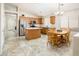 Open concept kitchen with stainless steel appliances, granite countertops, island, and dining area at 1144 E Elm Rd, San Tan Valley, AZ 85140