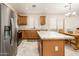 Well-equipped kitchen featuring stainless steel appliances, granite countertops, and a convenient island at 1144 E Elm Rd, San Tan Valley, AZ 85140