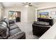 Inviting living area featuring vaulted ceilings, plush carpeting, and backyard access at 1144 E Elm Rd, San Tan Valley, AZ 85140