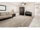 Cozy living room with neutral carpet, stylish furnishings, and a bright atmosphere at 1144 E Elm Rd, San Tan Valley, AZ 85140