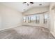 Spacious main bedroom with vaulted ceilings, plush carpet, and multiple windows at 1144 E Elm Rd, San Tan Valley, AZ 85140