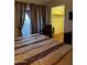 Spacious bedroom leading to a walk-in closet and balcony, creating a comfortable suite at 12123 W Bell Rd # 337, Surprise, AZ 85378