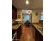 A dining room area with a dining table, four chairs and a view into the kitchen at 12123 W Bell Rd # 337, Surprise, AZ 85378