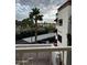 Balcony view of the building and landscaping with palm trees and carport at 12123 W Bell Rd # 337, Surprise, AZ 85378
