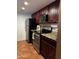 A kitchen showing stainless steel appliances, dark wood cabinets and stylish counter tops at 12123 W Bell Rd # 337, Surprise, AZ 85378