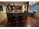 A spacious kitchen and dining area features stainless steel appliances and barstool seating at 12123 W Bell Rd # 337, Surprise, AZ 85378