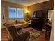 A cozy living space is illuminated by natural light, creating an inviting atmosphere with tile floors at 12123 W Bell Rd # 337, Surprise, AZ 85378