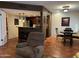 Open-concept living area with kitchen access, featuring tile floors and a comfortable layout at 12123 W Bell Rd # 337, Surprise, AZ 85378