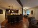 Living area showcases a bar-style kitchen counter, complete with stainless steel appliances and tile flooring at 12123 W Bell Rd # 337, Surprise, AZ 85378