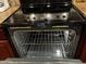 An open stainless steel Maytag oven showing interior at 12123 W Bell Rd # 337, Surprise, AZ 85378