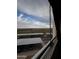 Window view of covered parking, landscaping, and Arizona sky at 12123 W Bell Rd # 337, Surprise, AZ 85378