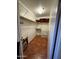 Organized walk-in closet with shelving, drawers, and tile flooring for tidy storage at 12123 W Bell Rd # 337, Surprise, AZ 85378