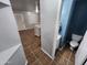 Adjacent to the kitchen is a powder room with neutral tile and contemporary toilet at 125 S 56Th St # 75, Mesa, AZ 85206