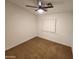 Comfortable bedroom with neutral carpet and walls, featuring a bright window for natural light at 125 S 56Th St # 75, Mesa, AZ 85206