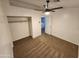 Cozy bedroom boasts a ceiling fan, carpet, closet, and neutral tones for relaxation at 125 S 56Th St # 75, Mesa, AZ 85206