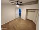 Spacious bedroom featuring a ceiling fan, neutral walls, carpet, and a convenient closet at 125 S 56Th St # 75, Mesa, AZ 85206