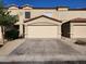 Charming townhome featuring a two-car garage, desert landscaping and a tile roof at 125 S 56Th St # 75, Mesa, AZ 85206