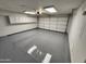 Spacious garage features epoxy flooring, overhead lighting, and ample storage cabinets at 125 S 56Th St # 75, Mesa, AZ 85206