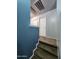 Carpeted staircase leading to the upper level, adjacent to a hallway in neutral paint at 125 S 56Th St # 75, Mesa, AZ 85206